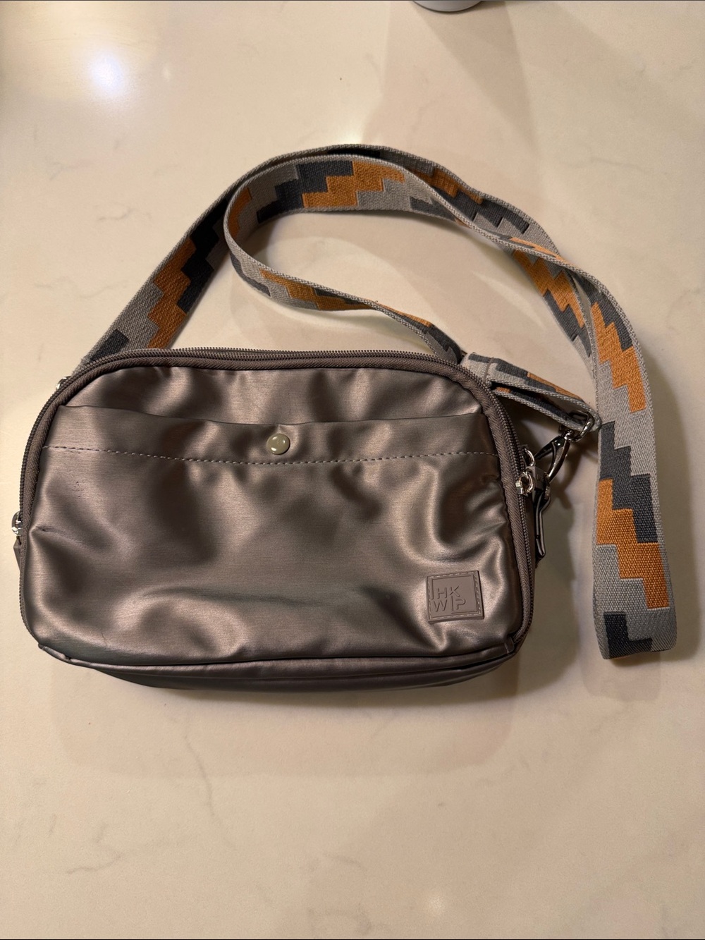 HK WIP Metallic Gray Crossbody Bag with Patterned Strap